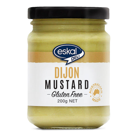 Glass jar of Eskal Deli Gluten Free Dijon Mustard, an authentic French style mustard that is ideal for spreading on sandwiches, hot dogs and hamburgers.