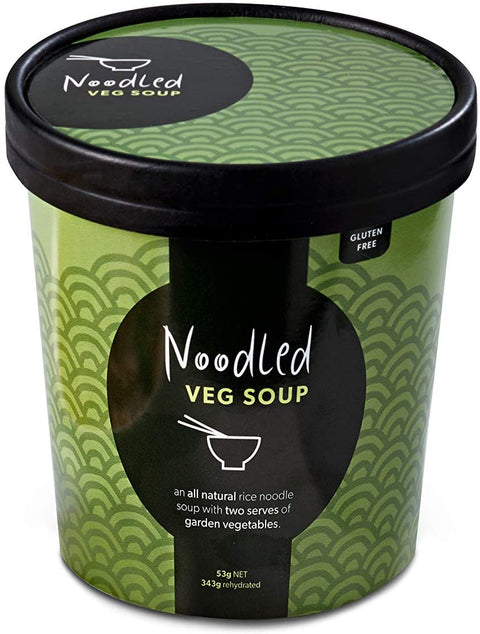 Green with black accents cardboard cup with lid. Noodled logo of a bowl with chopsticks printed on lid and on face of cup. Product type is printed on front; Veg Soup, along with statement about product being made with rice noodles and seven types of vegetables. Gulten Free claim is printed on the rim of the cup.
